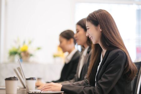Asian businessmen are working with laptops in the office.の写真素材