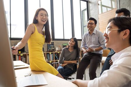 Asian business woman and her team presentation and meeting in modern office design planning ideas conceptの写真素材