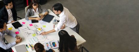 Group of Asian business people team meeting in modern office working design planning and ideas conceptの写真素材