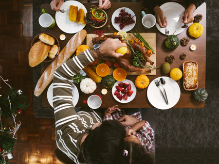 Group of people enjoying dinner with turkey together. Dining Wine Cheers Party thanksgiving Conceptの写真素材