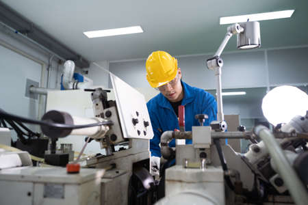 Portrait of Asian maintenance engineer workers working machines in the factory.の写真素材