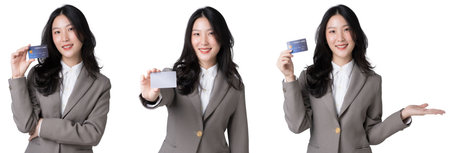 Young Asian businesswoman showing blank credit card in formal suit, Isolate die cut on transparent backgroundの写真素材