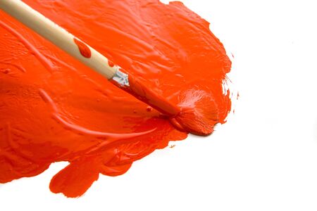 painting with paintbrush and red gouacheの写真素材