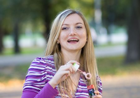 girl blowing bubblesの写真素材