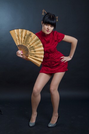 portrait of girl in geisha costume on black backgroundの写真素材