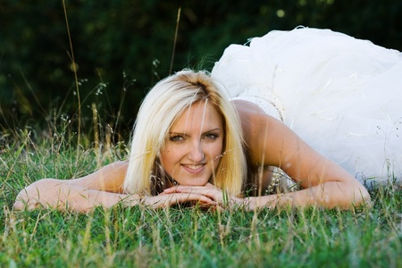 portrait of young beautiful bride in summer outdoorの写真素材
