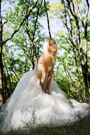 portrait of young beautiful bride in summer outdoorの写真素材