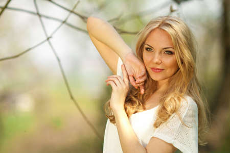 beautuful blond woman on meadowの写真素材