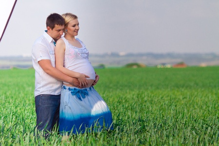 happy couple waiting baby in sunny dayの写真素材