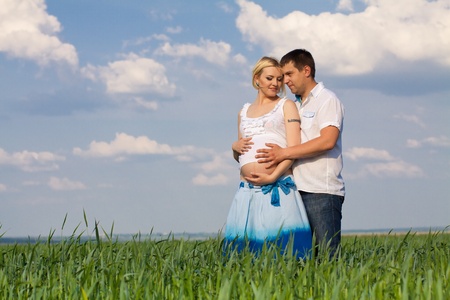 happy couple waiting baby in sunny dayの写真素材