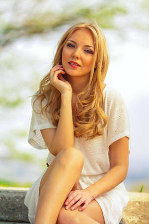 portrait of blond woman in white dress outdoor portrait of blond woman in white dress outdoor