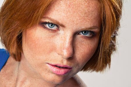 cute model in studio with red hairの写真素材