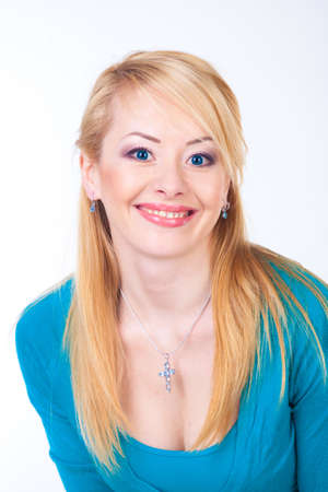 Portrait of gorgeous young woman smiling over white backgroundの写真素材