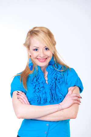 Closeup portrait of gorgeous young woman smiling over white backgroundの写真素材