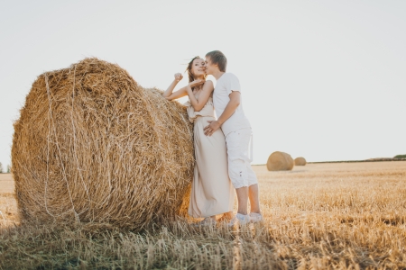 Image of young loving couple on wheat fieldの写真素材