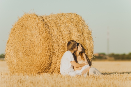 Image of young loving couple on wheat fieldの写真素材