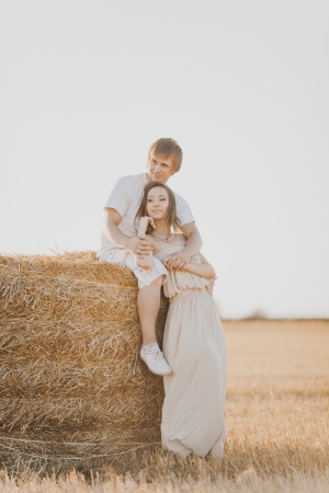Image of young loving couple on wheat fieldの写真素材