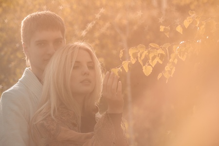 happy young couple in love outdoor in autumnの写真素材