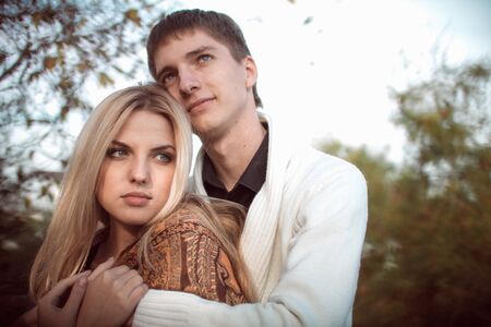 happy young couple in love outdoor in autumnの写真素材