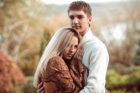 happy young couple in love outdoor in autumnの写真素材