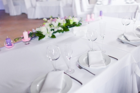 Celebratory tables in the banquet hall decorated with flowersの写真素材