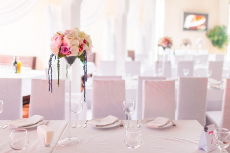 Celebratory tables in the banquet hall decorated with flowersの写真素材