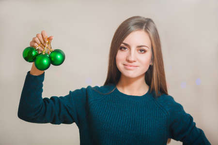 Young woman with christmas ball isolated on whiteの写真素材
