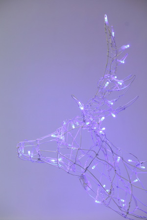 Christmas wicker iron deer with lightsの写真素材