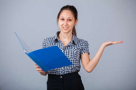 Education, technology and people concept. Girl with folderの写真素材