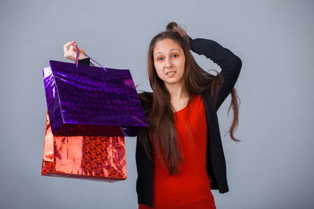Pretty woman with shopping paper bag isolated