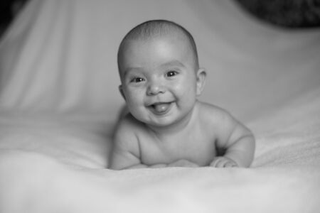 Portrait of cute little baby on blanketの写真素材