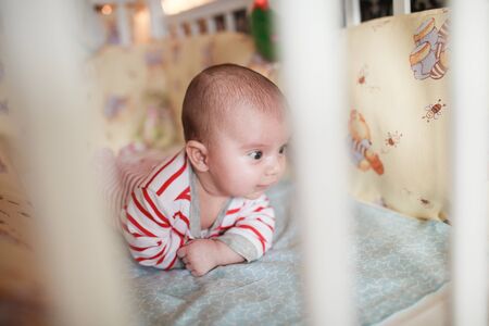 Portrait of cute little baby on blanketの写真素材