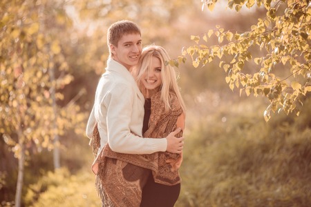 happy young couple in love outdoor in autumnの写真素材