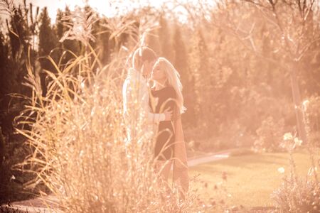 happy young couple in love outdoor in autumnの写真素材