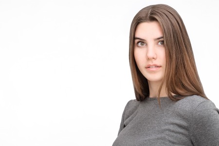 Close-up portrait of beautiful woman on isolated backgroundの写真素材