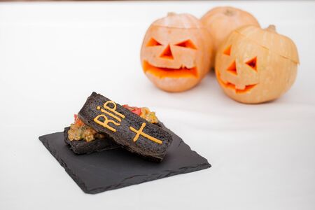 halloween vegetable dish in coffin on white backgroundの写真素材