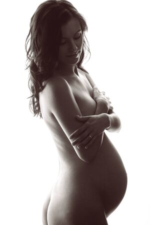 beautiful pregnant woman isolated on white backgroundの写真素材