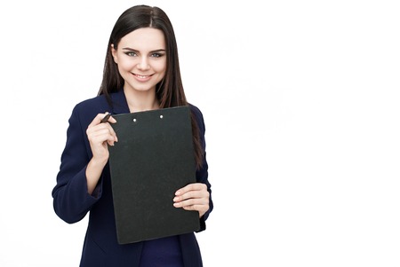 Happy young woman holding tablet isolated on white backgroundの写真素材