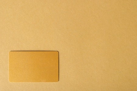 Presenting business card on brown desk with advertisment