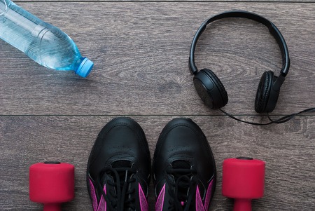 Sport. Outfit for exercises. Equipment for good training on wooden backgroundの写真素材