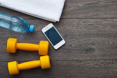 Sport. Outfit for exercises. Equipment for good training on wooden backgroundの写真素材