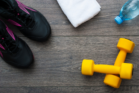 Sport. Outfit for exercises. Equipment for good training on wooden backgroundの写真素材