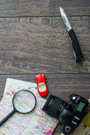 Outfit of traveler or student. Overhead of essentials for modern young person. Different objects on wooden background.の写真素材