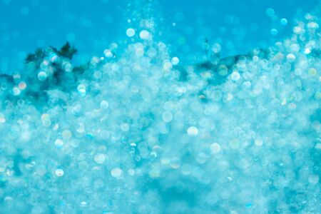 Blue water backdrop. Absract background with water splashesの写真素材