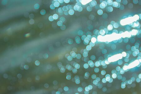 Defocused blue lights abstract background. Natural photo bokeh patten