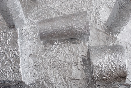 Silver foil figures with shiny crumpled surface. Contemporary artの写真素材