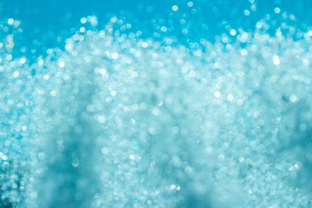Blue water backdrop. Absract background with water splashesの写真素材