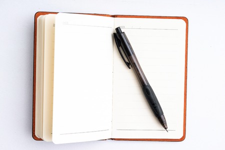 notepad with black pen isolated on white