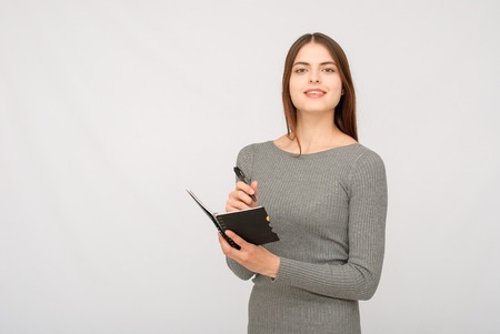 Smiling business woman with folded hands against . Toothy smile, crossed arms.の写真素材