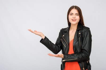 Advertisment. Young succesful businesswoman.Woman in dress show copyspaceの写真素材